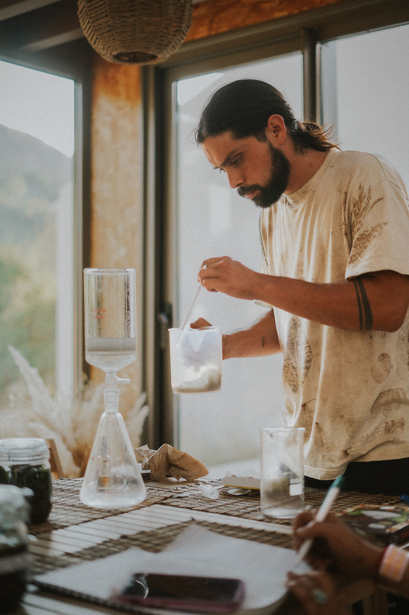 Luciano preparing a botanical extraction in the laboratory